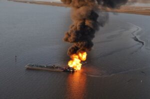 Dangers of Transporting Fossil Fuels: A pipeline burns after an allision with tug boat Shanon E. Setton, near Bayou Perot 30 miles south of New Orleans, March 13, 2013. The Coast Guard is working with federal, state and local agencies in response to this incident to ensure the safety of responders and contain and clean up any oil that is leaking. (U.S. Coast Guard photo courtesy of Coast Guard Air Station New Orleans)
